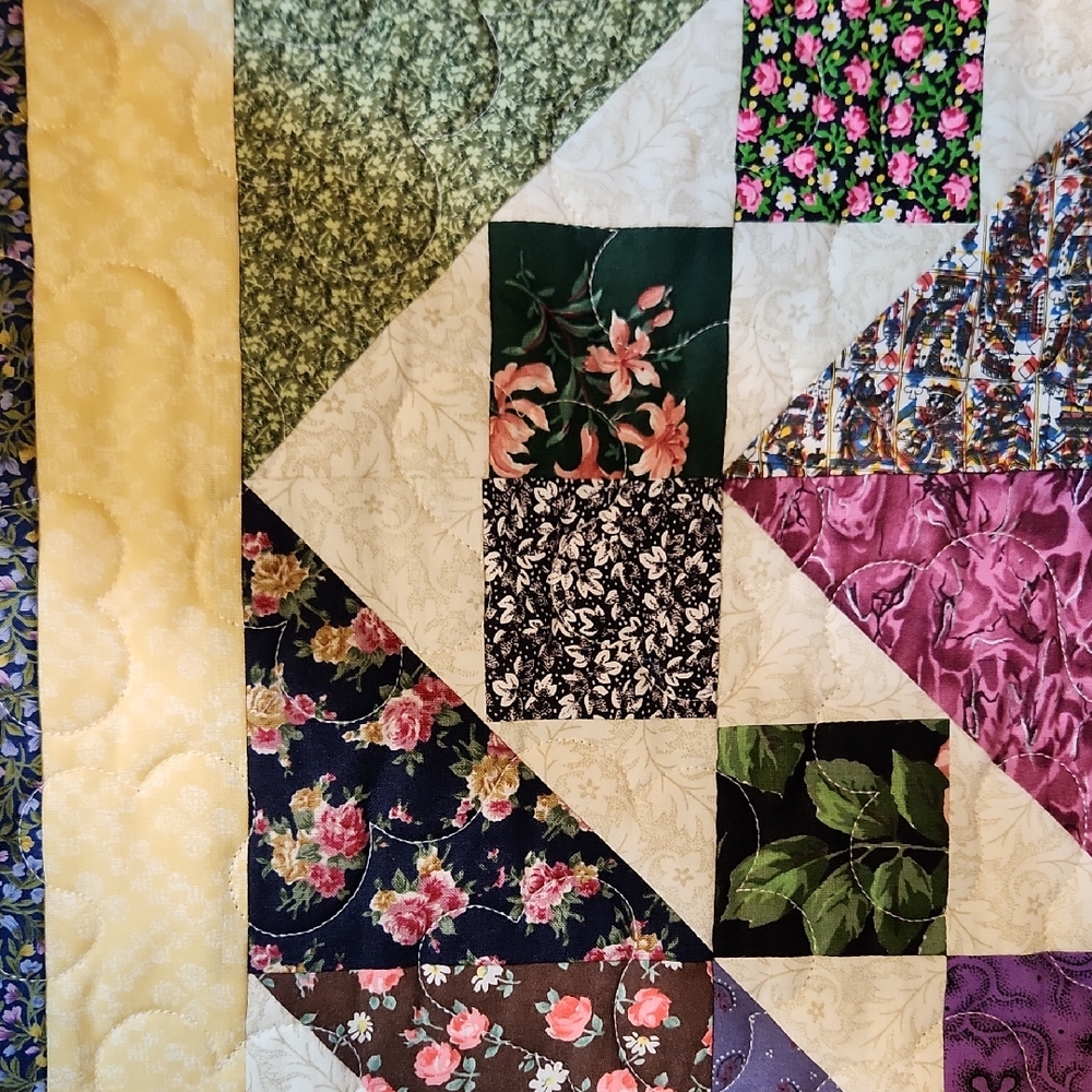 This scrappy quilt done by myself.